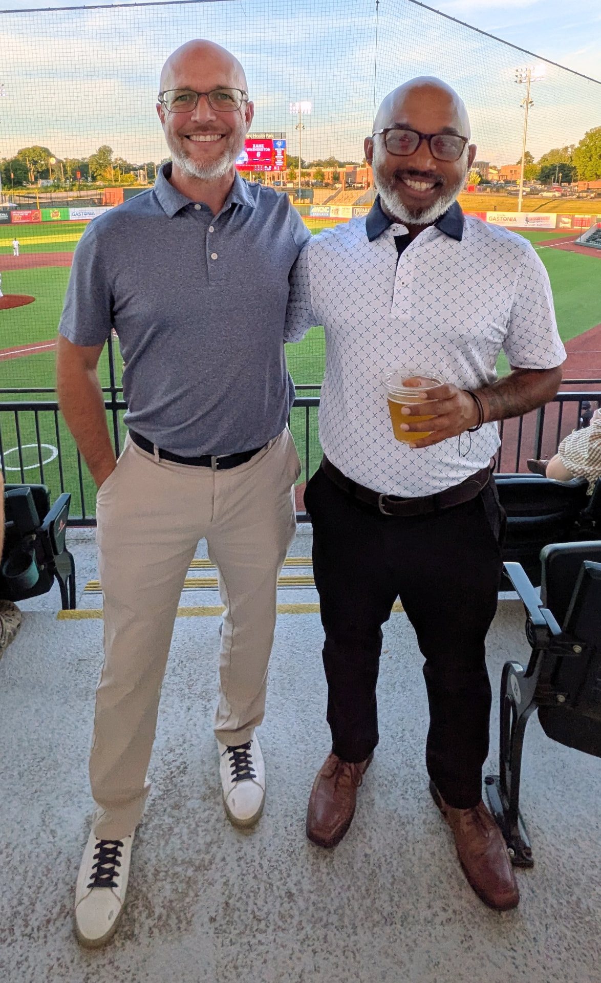 Sharif Rehman with a colleague at a Gastonia baseball game